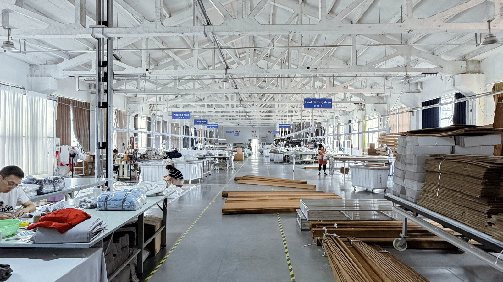 Huajing production workshop — pleating, lining, heat setting areas